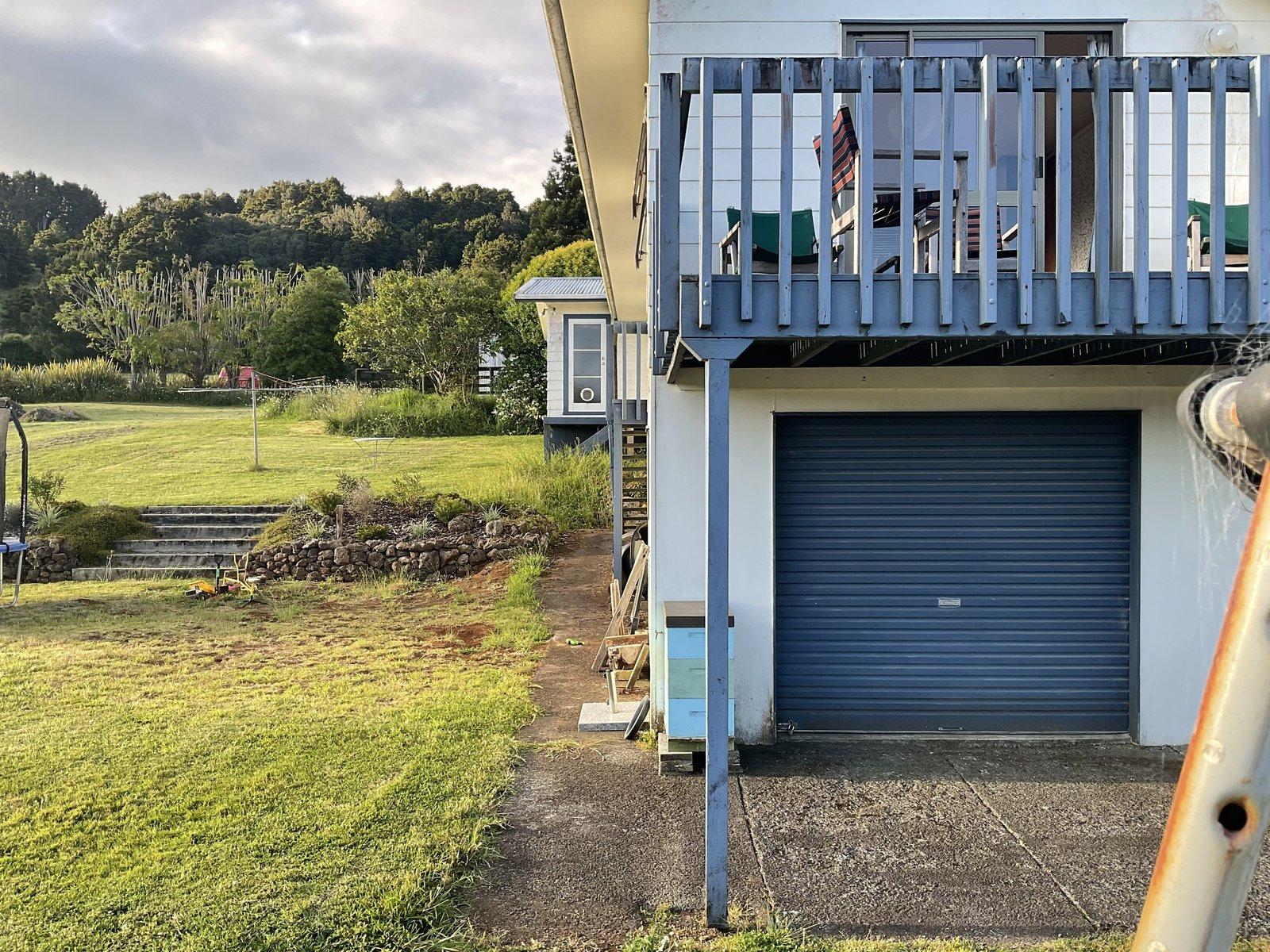 Old deck structure and garage area