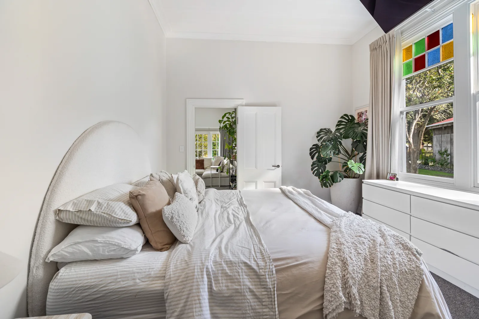 Finished villa bedroom with stained-glass details