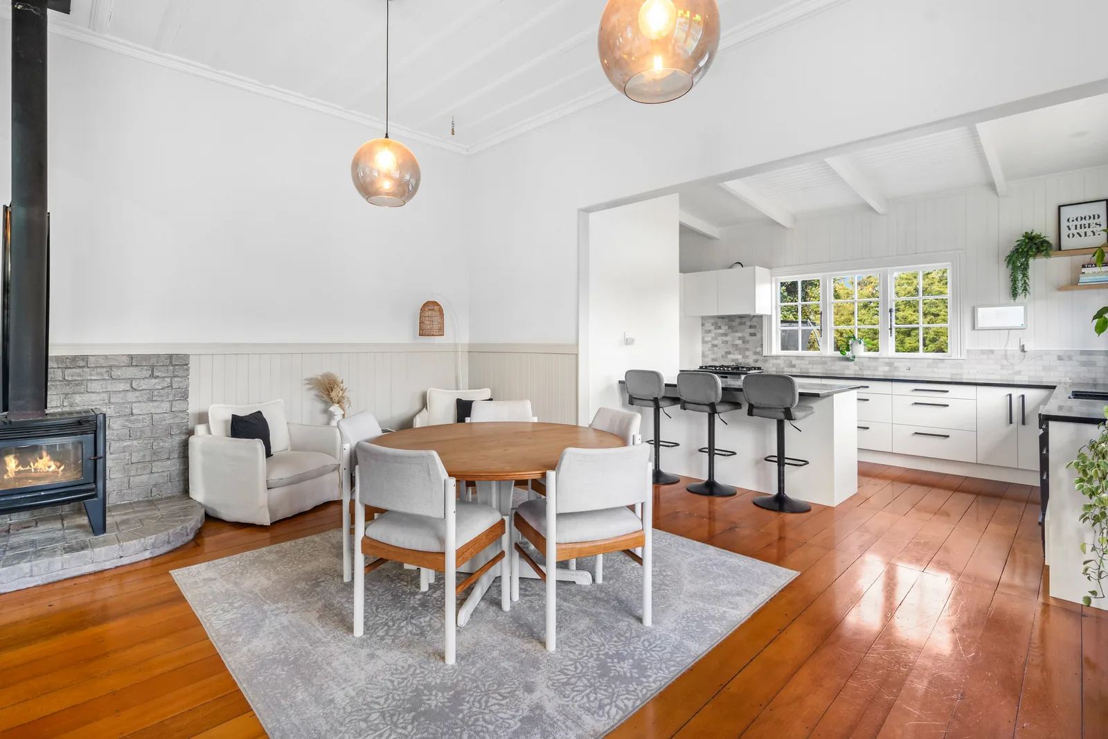 Finished dining space opening towards the renovated kitchen