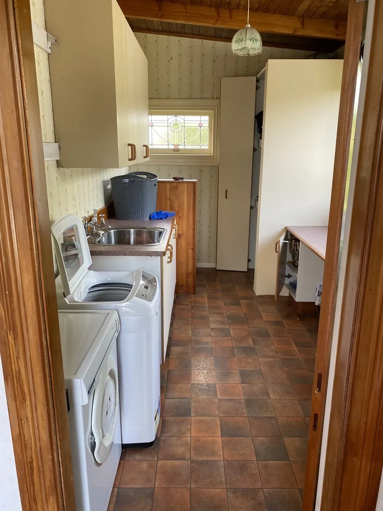 Room used as the laundry before its conversion to a bathroom