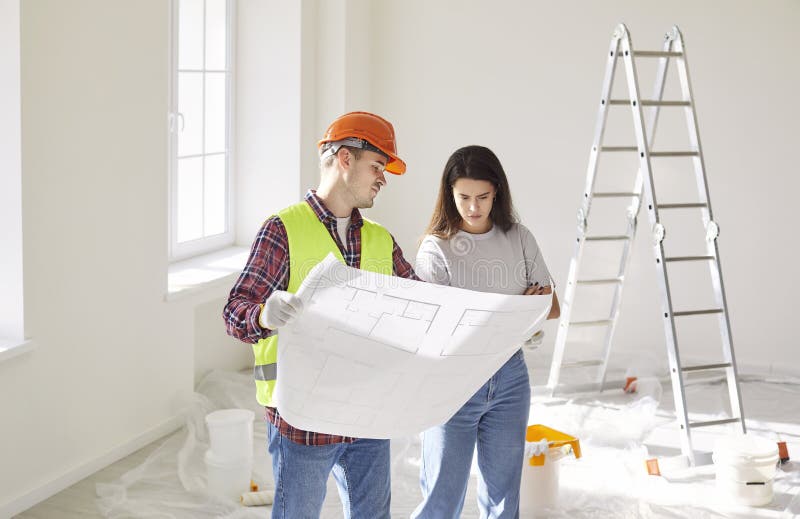 Builder and client reviewing consent documentation together